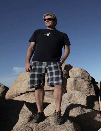 Charlie Webb standing on large rocks